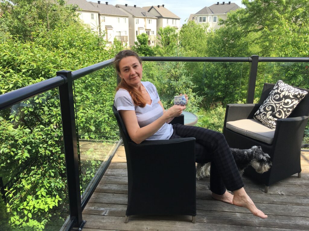 woman-sitting-with-cup-of-coffee-on-summer-day-out-2025-01-08-02-34-14-utc